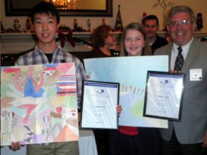 Peace Poster winners Seungmin Lee (Rocky Run Middle School) and Hailey Steen (Stone Middle School) display their winning Peace Posters and certificates with Lion Jeff Root, FHLC Peace Poster Chairperson.
